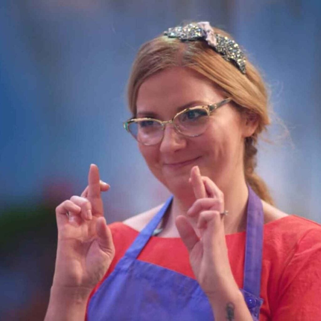 Hanelore on the set of Crazy Delicious Netflix show crossing fingers