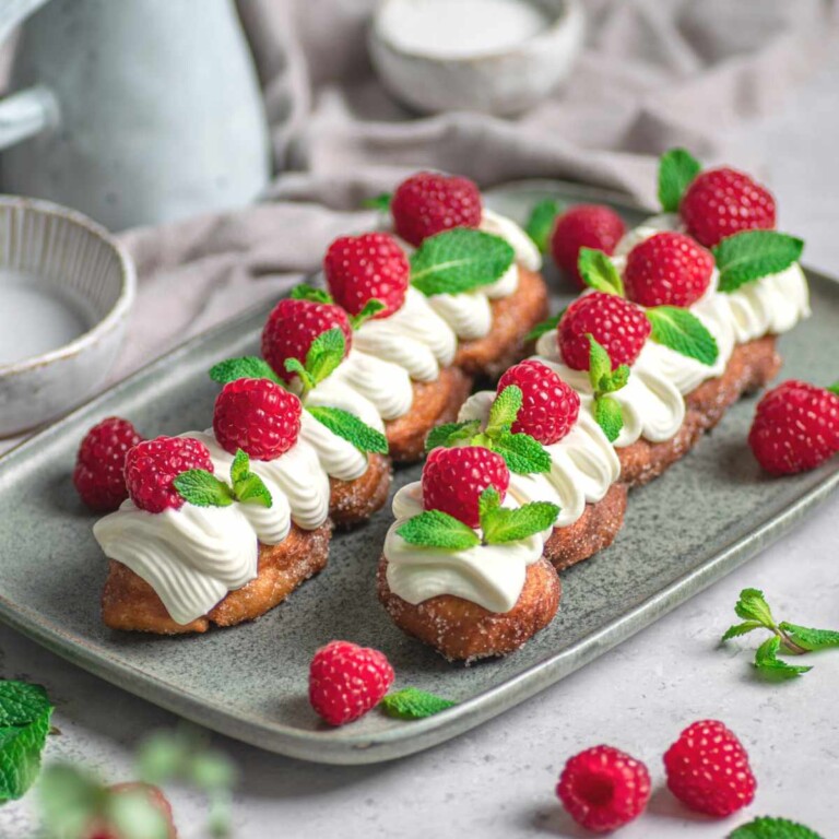 Kkwabaegi, Korean twisted donuts coated in sugar and topped with whipped cream, raspberries and mint