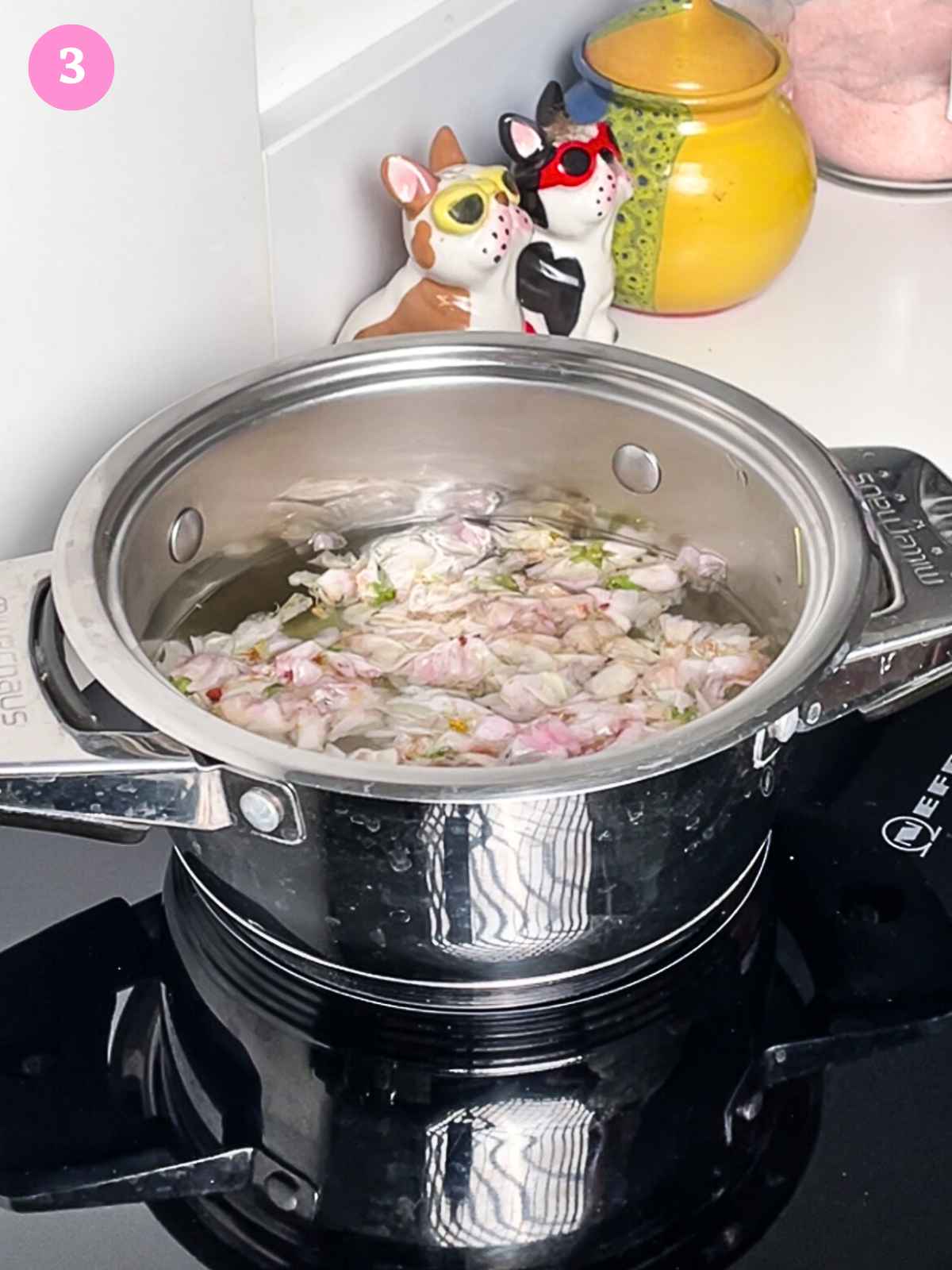 Cooked flowers and water inside pot on stove