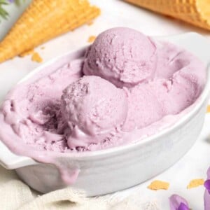 Double Scoop of Purple and Blue Ice Cream Cone on a White