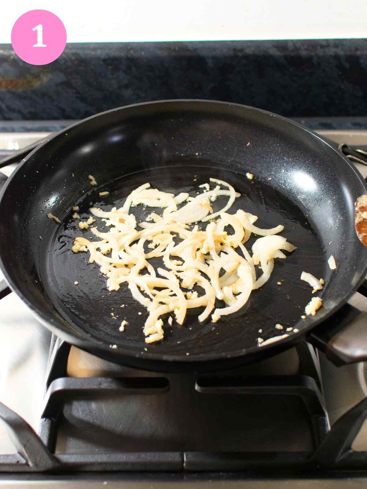 Stir frying onion and garlic in black pan