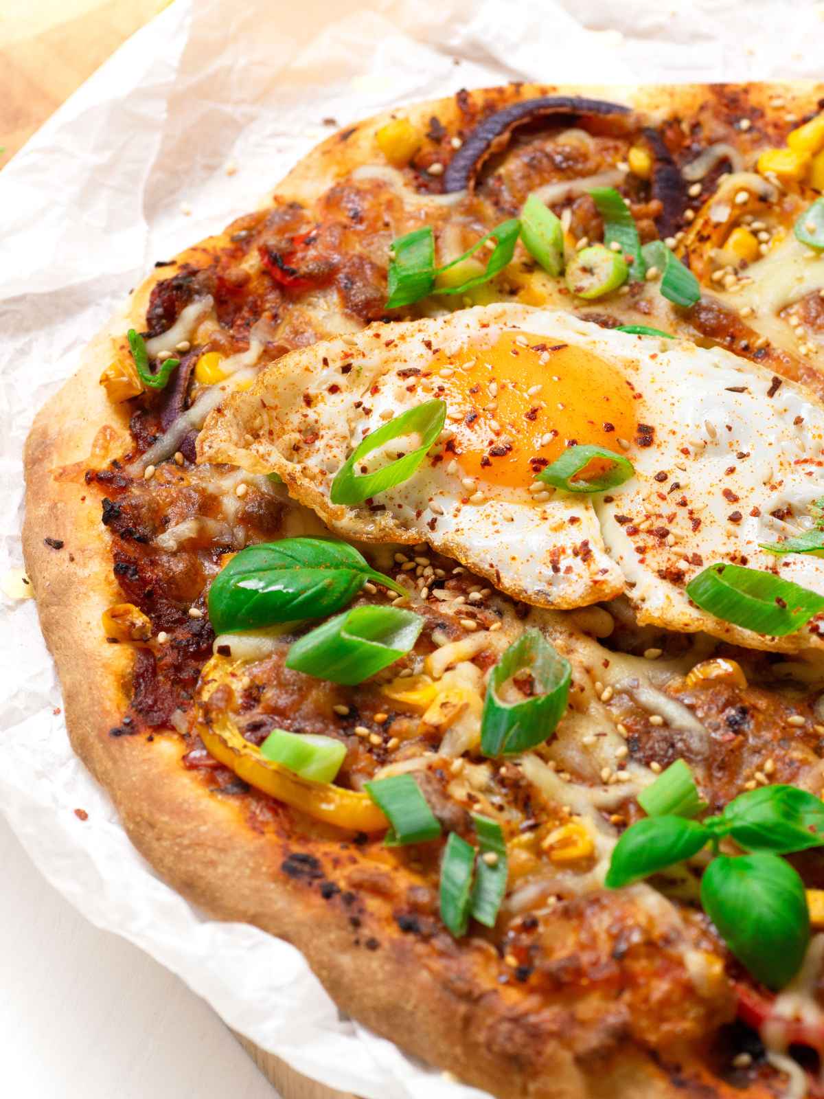 fried egg on top of kimchi pizza