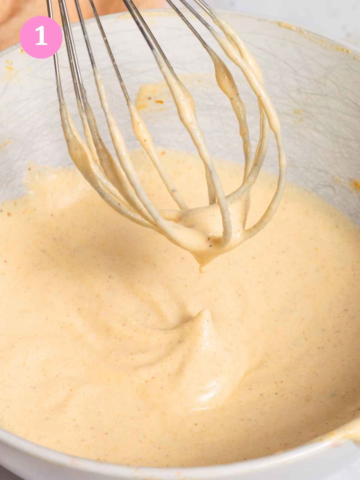 whisking pumpkin cream in bowl
